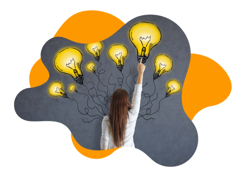 Eine junge Frau, die mit dem Rücken zur Kamera vor einer grauen Betonwand steht, auf der ein Grafitti mit neun unterschiedlich großen, gelb gefärbten Glühlampen mit Drähten zu sehen ist. Sie zeigt mit dem rechten Zeigefinger auf die größte von diesen.